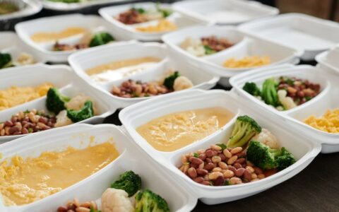 Delicious and nutritious meal prep featuring broccoli, beans, and eggs in containers.